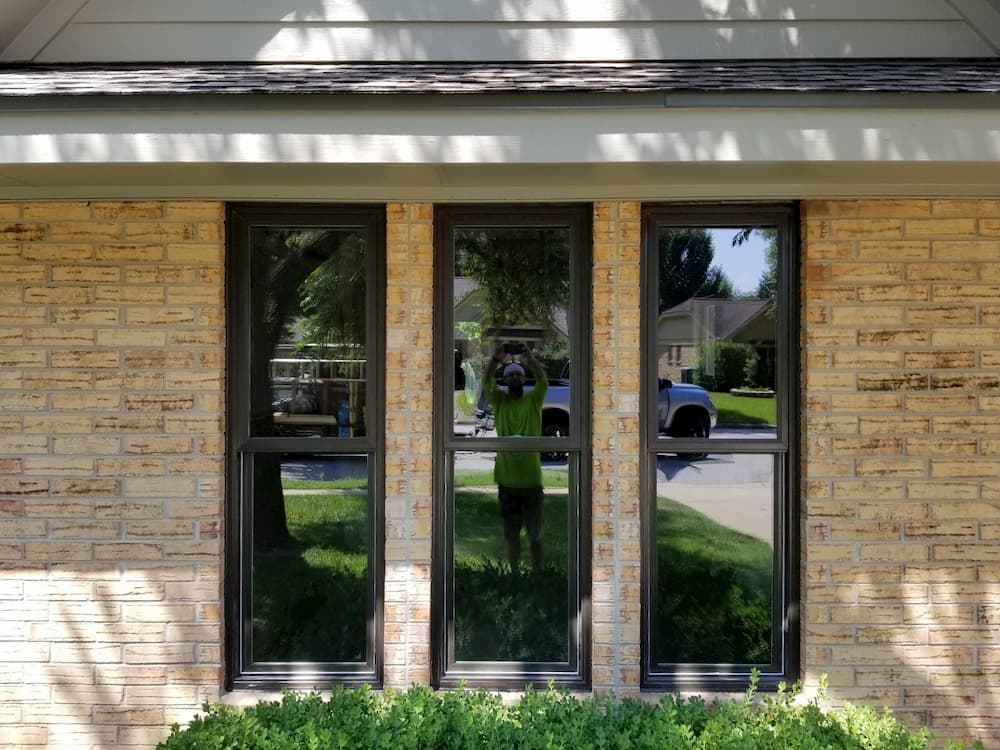New fiberglass double-hung windows on brick home