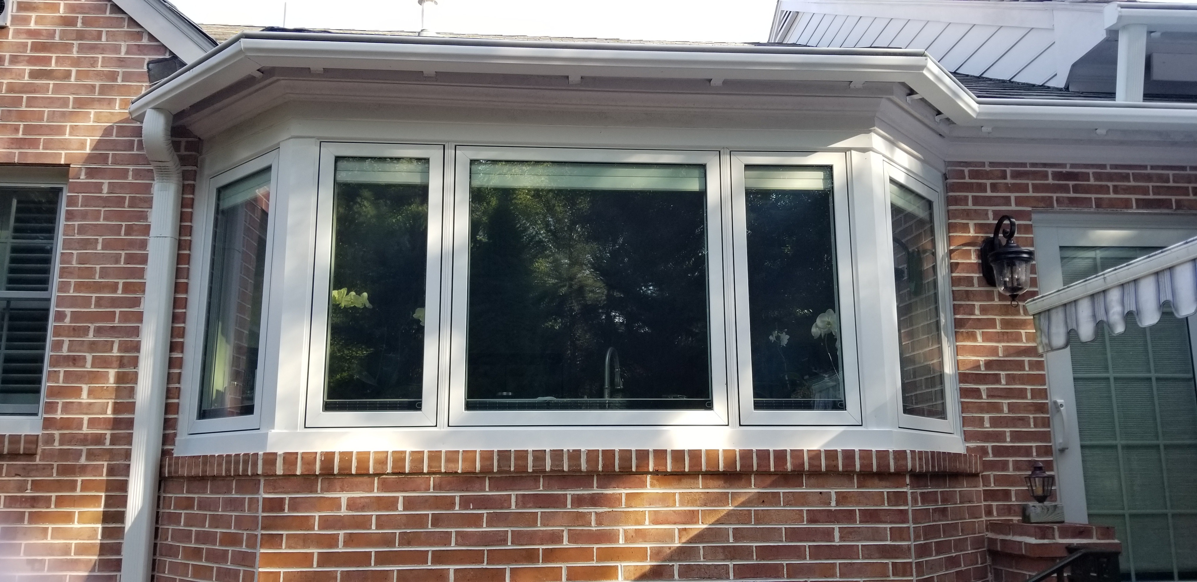 Close-up of Richmond home's sunroom exterior with new bow window