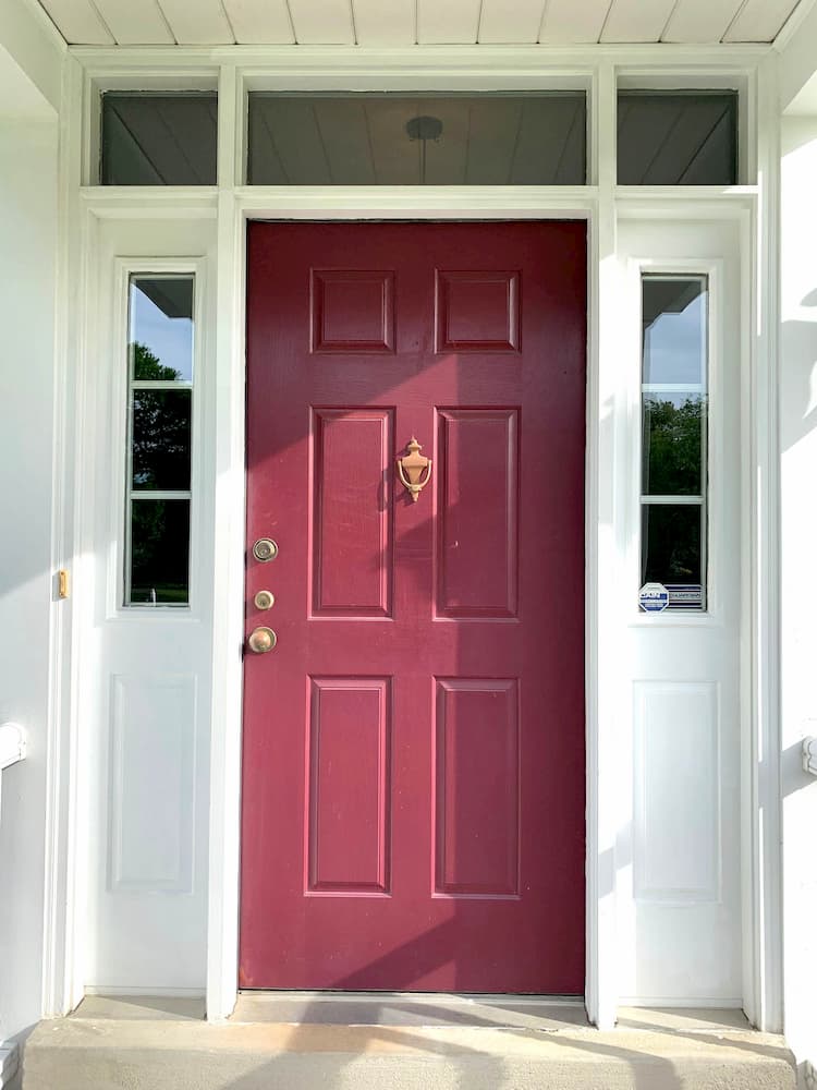 Old wood entry door with sidelights and transom windows on Cranberry, Pennsylvania, home.