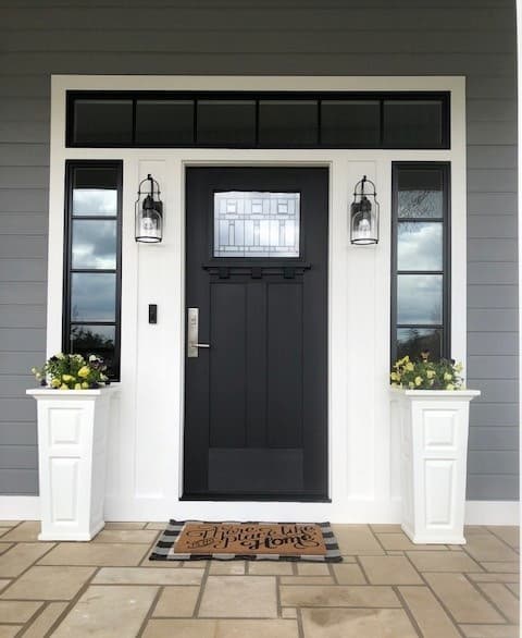 Black fiberglass entry door with sidelights on home in Manhattan, Kansas