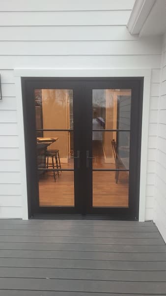 Black double patio door with glass view from the outside