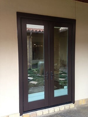 Hinged patio doors with brown hardware