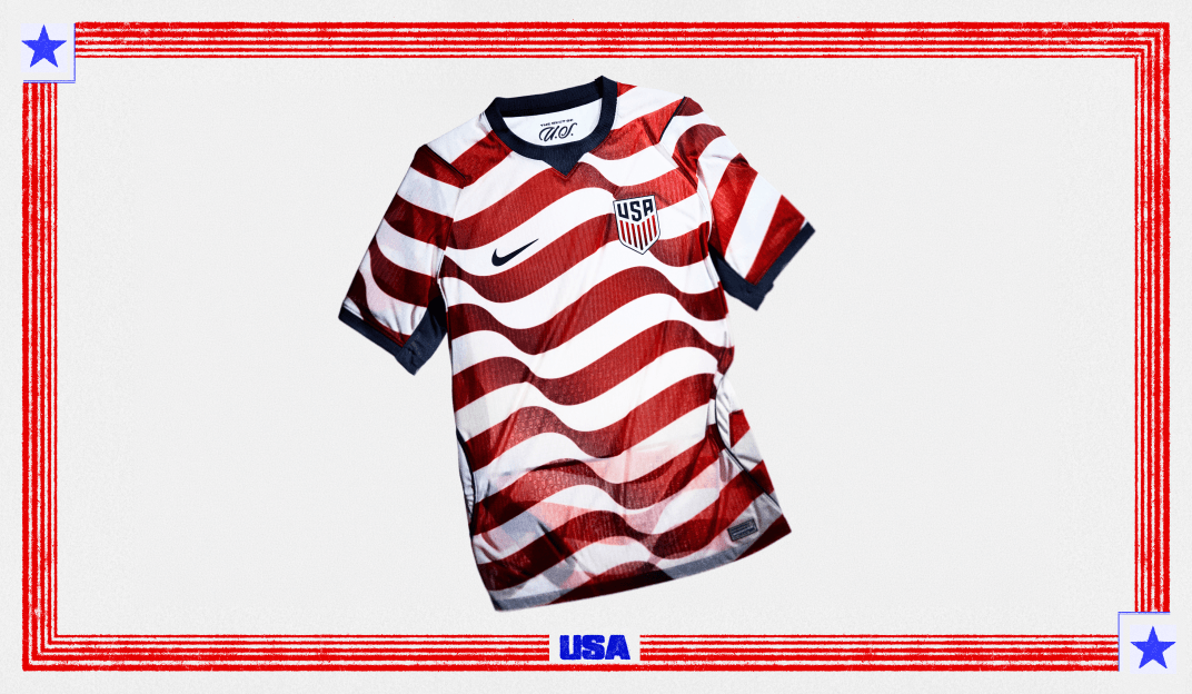 Red and white striped Nike USA home soccer jersey with blue trim and a USA team crest, displayed on a plain background.