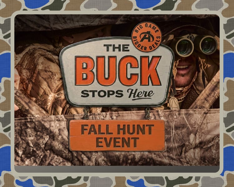 Hunting-themed promotional sign reading The Buck Stops Here and Fall Hunt Event displayed with camouflage accents and outdoor gear imagery.