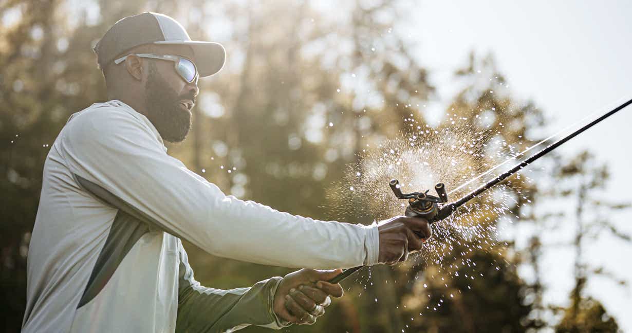 Man fishing with his rod and reel combo