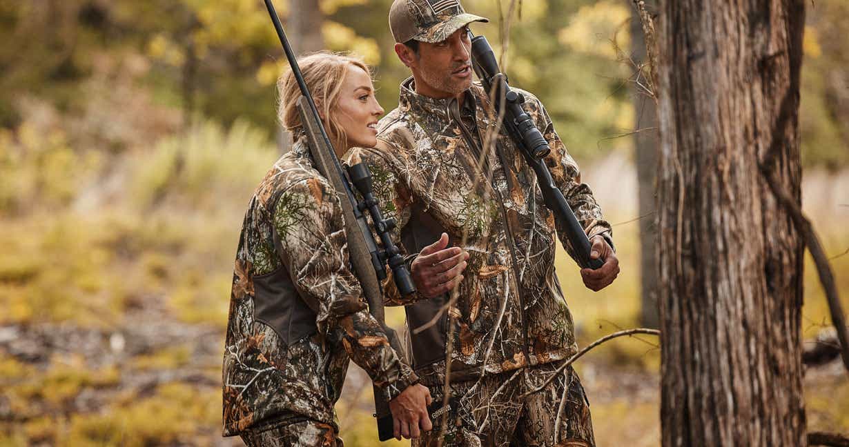 Man and his daughter hunting in the wilderness