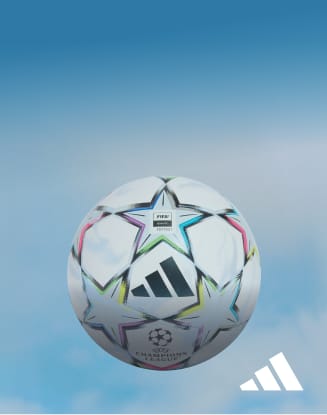 adidas Champions League soccer ball against a blue sky background.