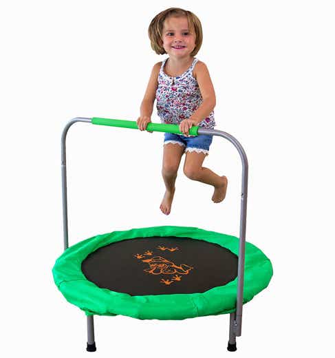 child jumping on mini trampoline