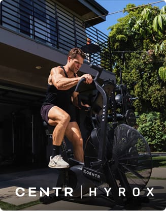 Person exercising on a HYROX training machine outdoors. CENTR x HYROX logos appear at the bottom of the image.