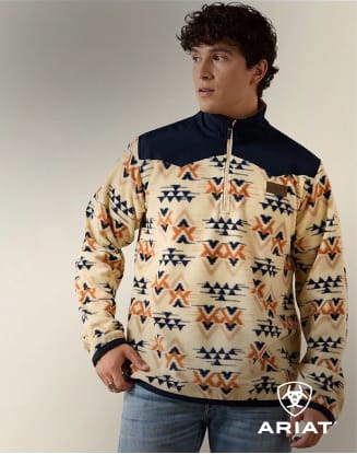 erson standing beside a horse wearing western-inspired apparel.P