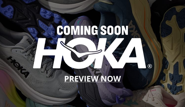 Assorted HOKA running shoes in gray, blue, purple and tan, with HOKA logo.