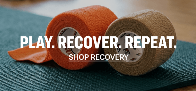Two rolls of athletic tape in orange and beige on a green exercise mat with the text Play. Recover. Repeat. Shop Now