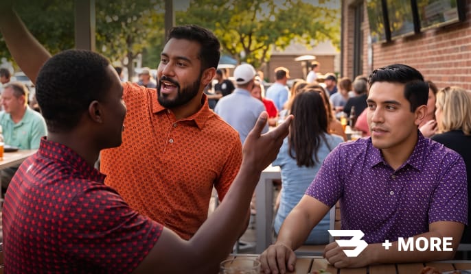 Group gathered outdoors wearing casual apparel featuring a Burlebo brand logo and additional fan gear brands.