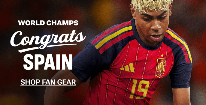 Promotional banner featuring a soccer player in a red and navy Spain national team jersey. White text reads, “World Champs Congrats Spain” and “Shop Fan Gear,” set against a blurred stadium-style background.