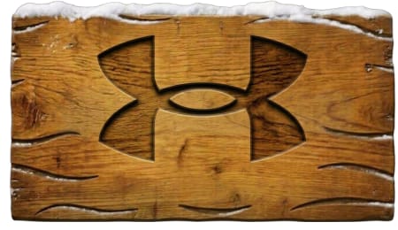 BURLEBO logo carved into a weathered wooden surface topped with snow.