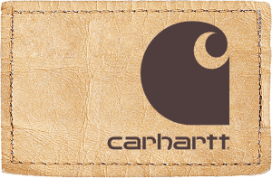 Carhartt leather patch with the Carhartt logo and stitched border on blue denim.