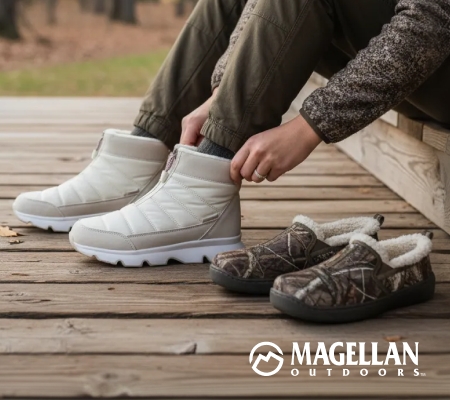 Person sitting on a wooden deck putting on white insulated boots, with camouflage slip-on shoes and fur lining nearby, highlighting Magellan Outdoors footwear.