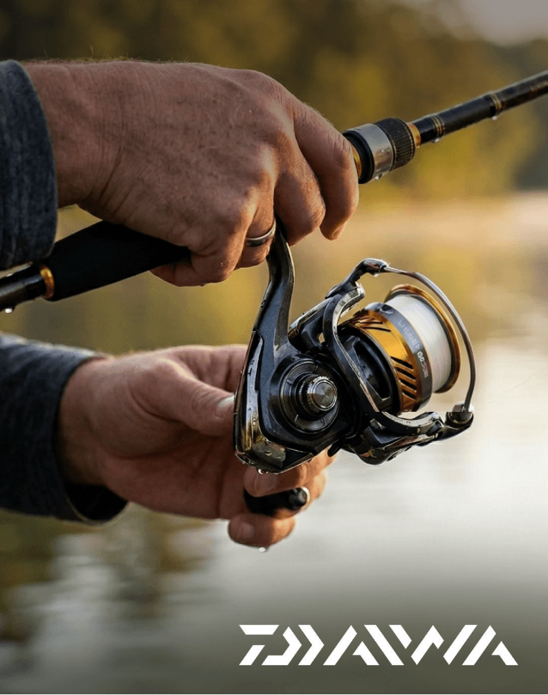 Close-up of a Daiwa fishing rod and reel combo in use.
