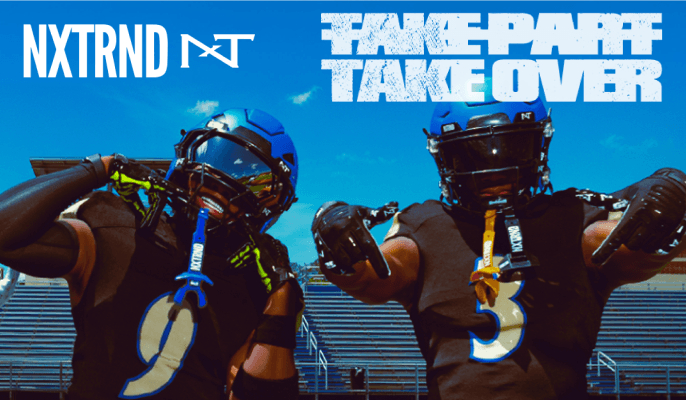 Two football athletes in black uniforms wearing helmets and holding mouthguards, with NXTRND branding and 'Take Part Take Over' text above.