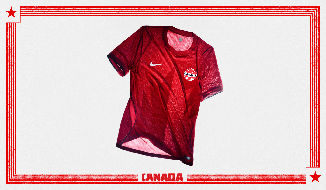 Red Nike Canada home soccer jersey with subtle diagonal patterning and the Canada team crest, displayed on a plain background.