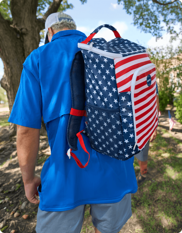 Igloo Americana flag–pattern backpack cooler worn on the back.