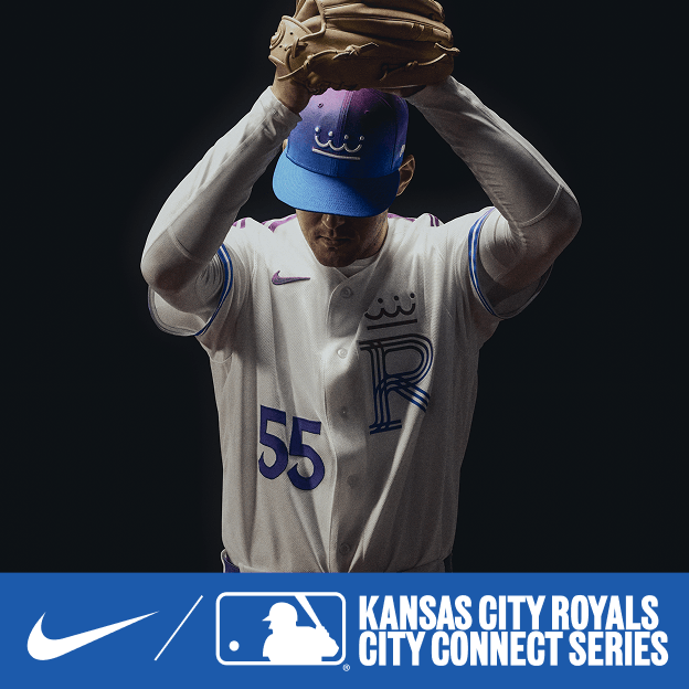 Professional baseball player wearing a white Kansas City Royals City Connect jersey and cap, holding a mitt in dramatic studio lighting.