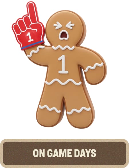Gingerbread character holding a red foam finger with a surprised expression. Text below reads “On Game Days.”