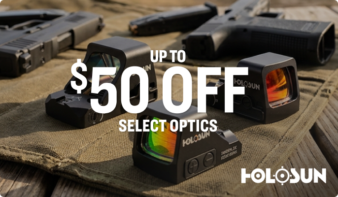 Multiple compact red dot sights displayed on a surface with firearms in the background, with overlaid text “UP TO $50 OFF SELECT OPTICS” and Holosun logo.