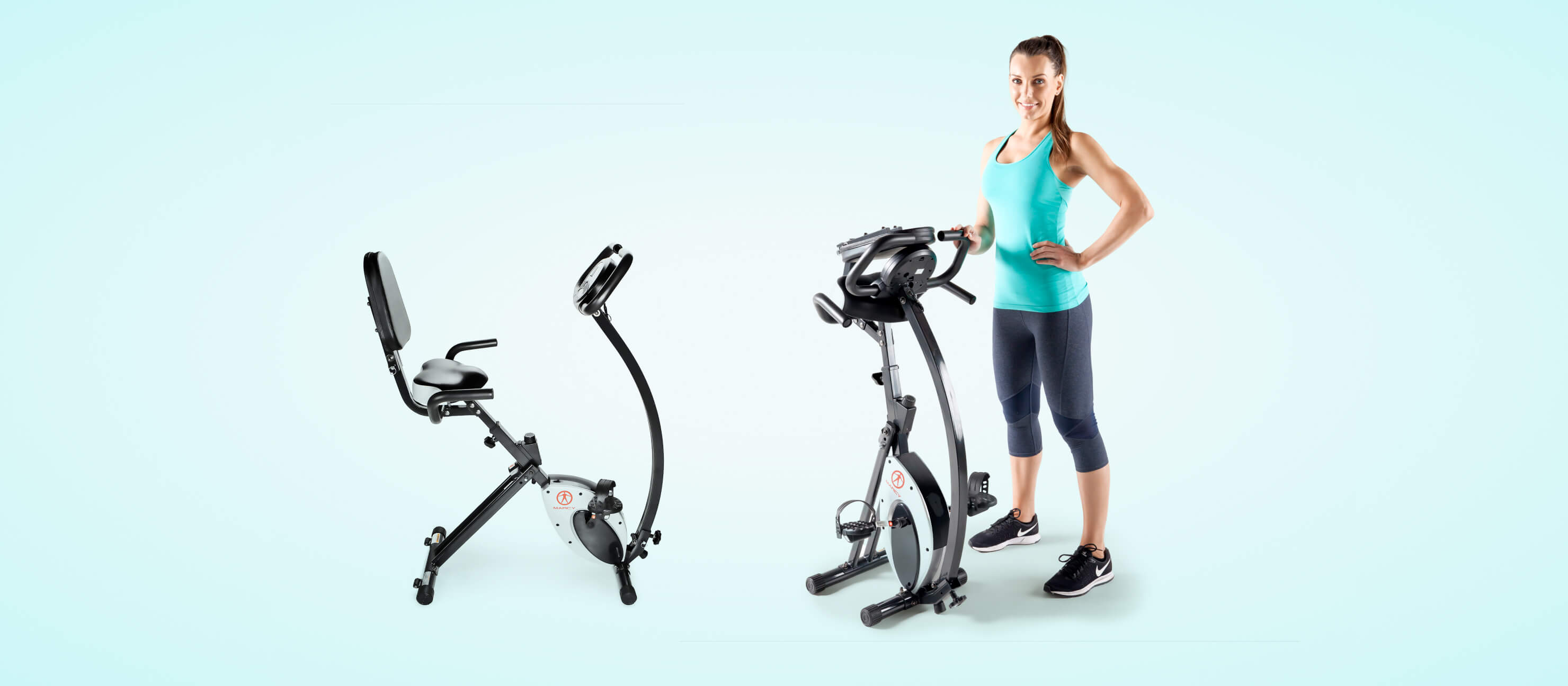 Woman stands next to a foldable exercise bike with her hand on her hips