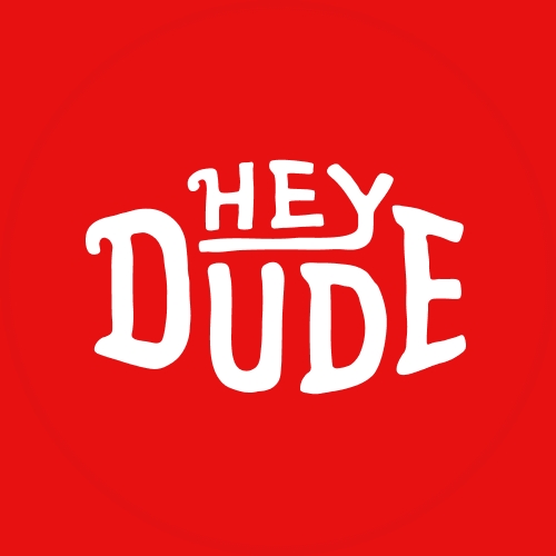 White HEYDUDE logo on a solid red background.