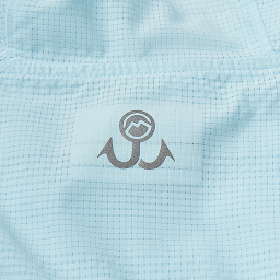 Close-up of a light blue performance fabric of a Jacob Wheeler Magellan Outdoor Pro Ventilated Hoodie.