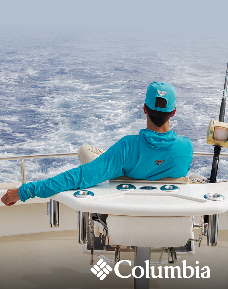 Promotional image showing a person fishing from a boat on open water wearing a teal fishing shirt.
