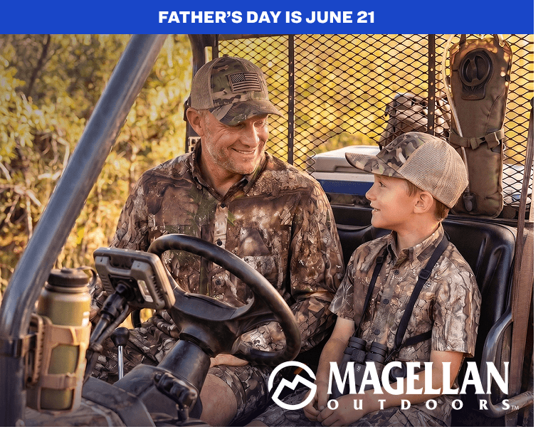Two people wearing camouflage apparel seated in a utility vehicle outdoors.