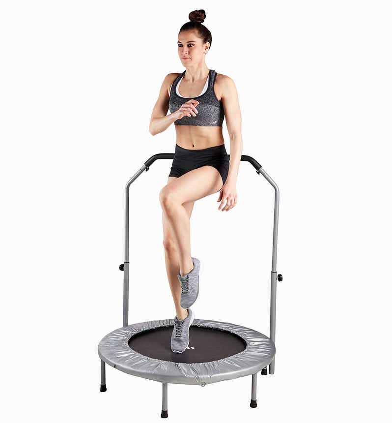 woman exercising on fitness trampoline
