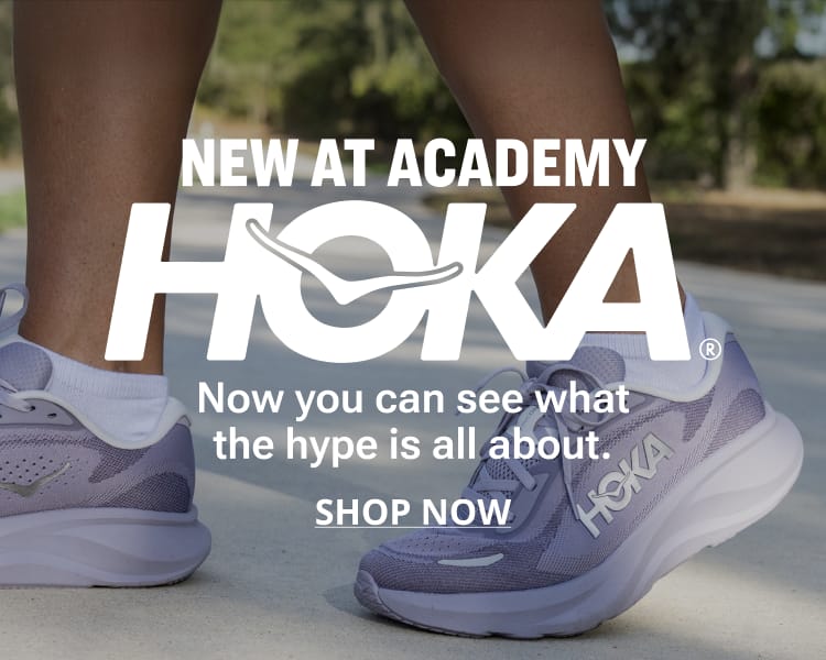 New at Academy HOKA running shoes displayed in a close-up lifestyle image. Text reads: “NEW AT ACADEMY HOKA. STOPS HERE. Now you can see what the hype is all about.” A Shop Now button appears at the bottom.