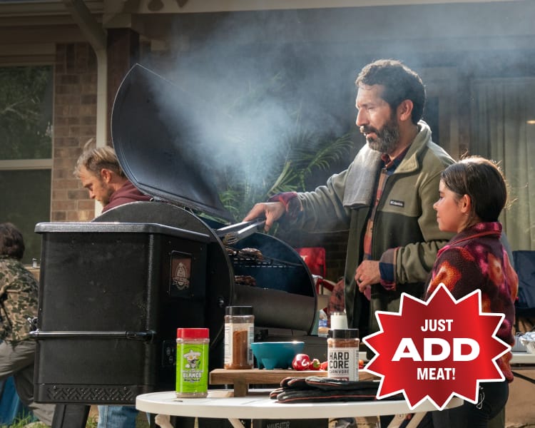 Image of a Pit Boss wood pellet grill in use outdoors, with two people standing beside the grill. Overlay red badge says “Just Add Meat.”