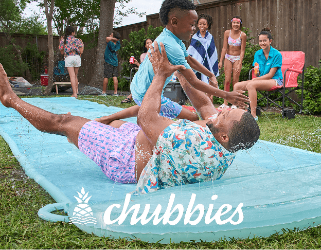 Group of people wearing Chubbies on a slip-n-slide.
