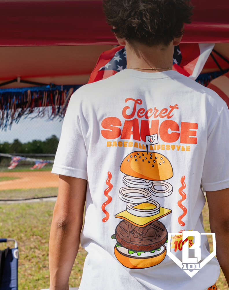Person wearing a white graphic t-shirt with a burger design, with Baseball lifestyle 101 branding.