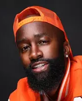 Portrait of Kiotti Brown wearing an orange cap.