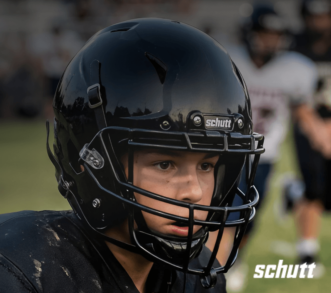 Schutt A5 Recruit football helmet close up with protective face mask.