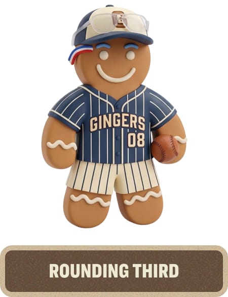Gingerbread character dressed in a baseball uniform and cap, holding a baseball glove and ball. Text below reads “Rounding Third.”