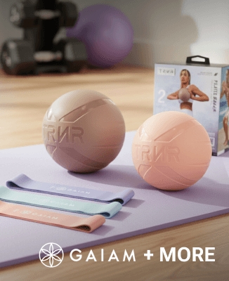 Two exercise balls—taupe and pink—on a purple yoga mat with pastel resistance bands. GAIAM logo featured in the bottom right.