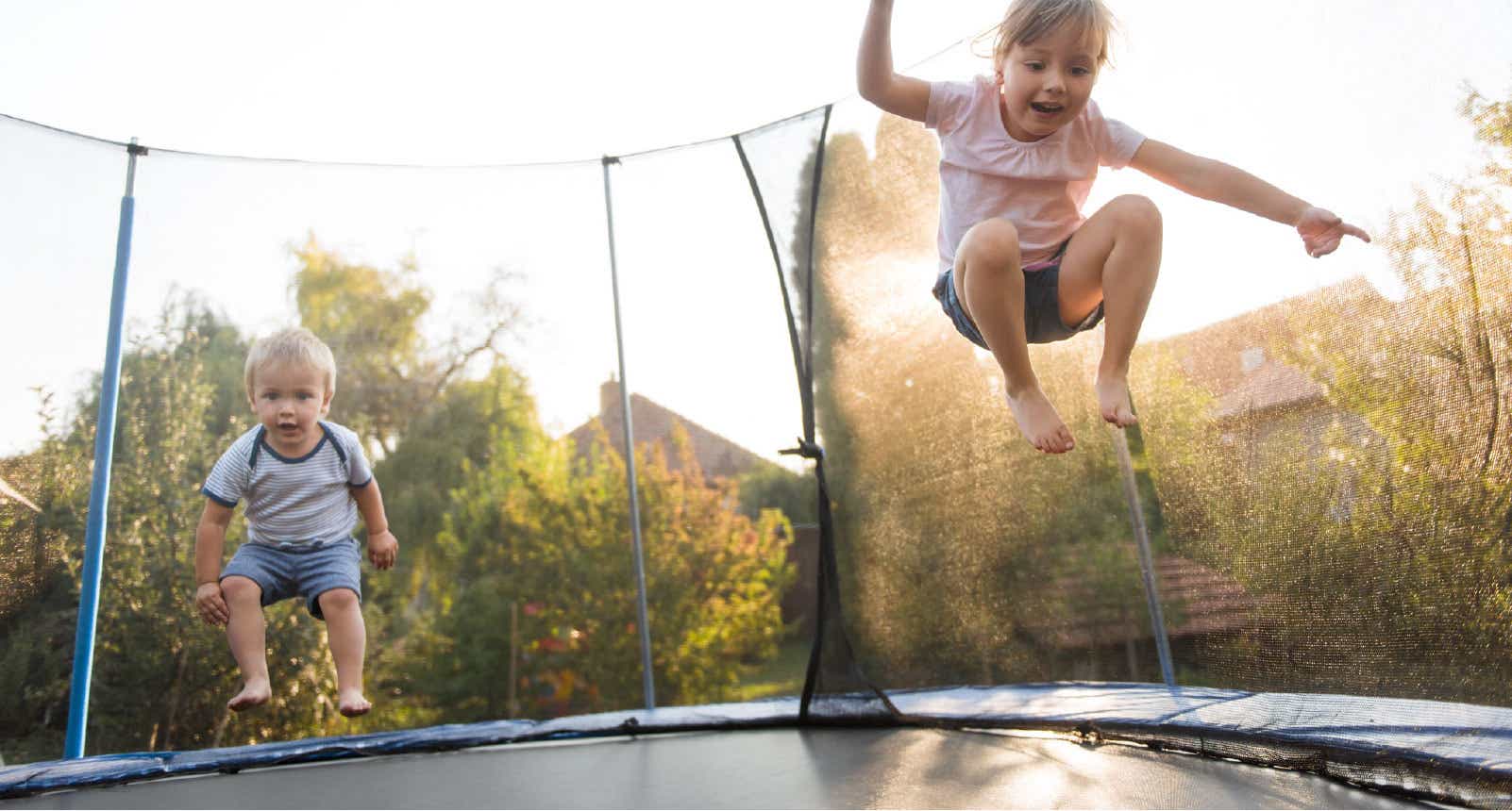 children jumping on trampoline