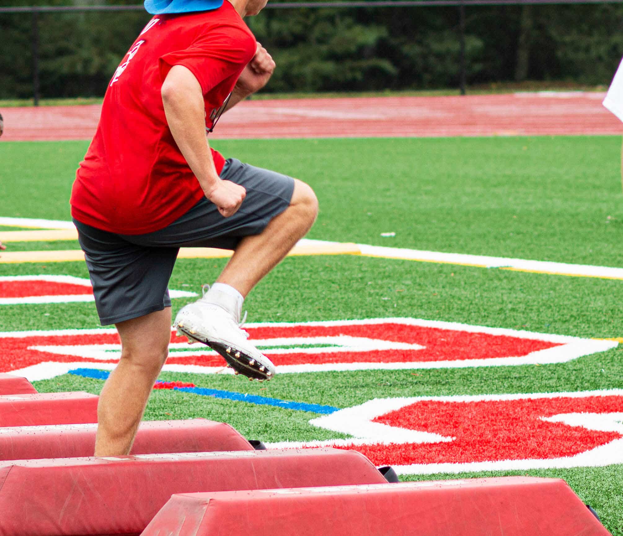 Football player wearing cleats while drilling