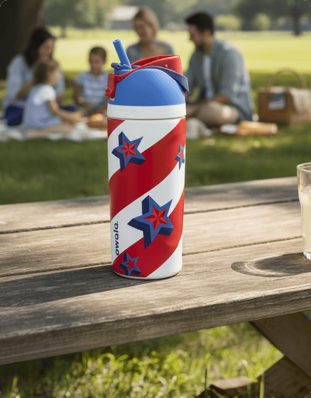 Owala FreeSip stainless steel water bottle with red, white, and blue star design.