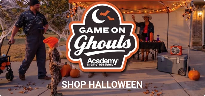 Halloween patio scene with costumed figures, pumpkins, spooky decorations, and Academy Sports + Outdoors Game On Ghouls branding. Shop Halloween.