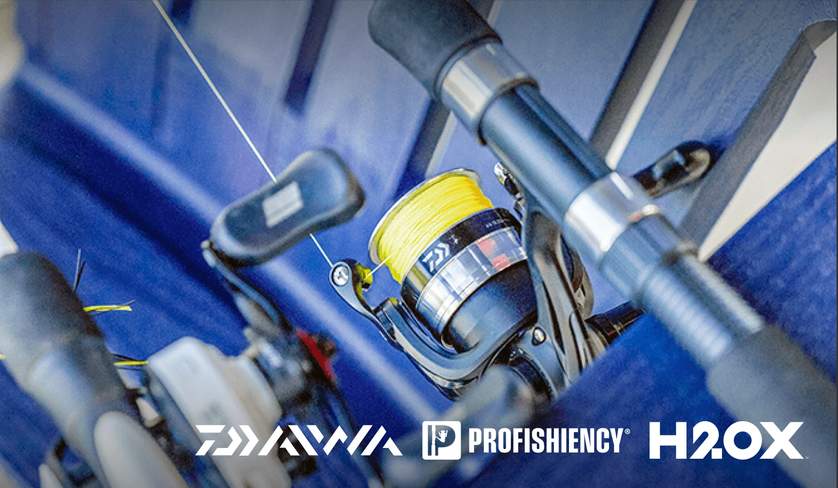 Close-up of fishing rods and reels arranged in a boat, with brand logos Daiwa, ProFISHiency, and H2OX.