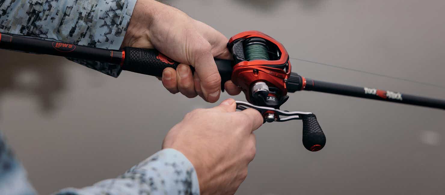 Person fishing with a baitcast reel
