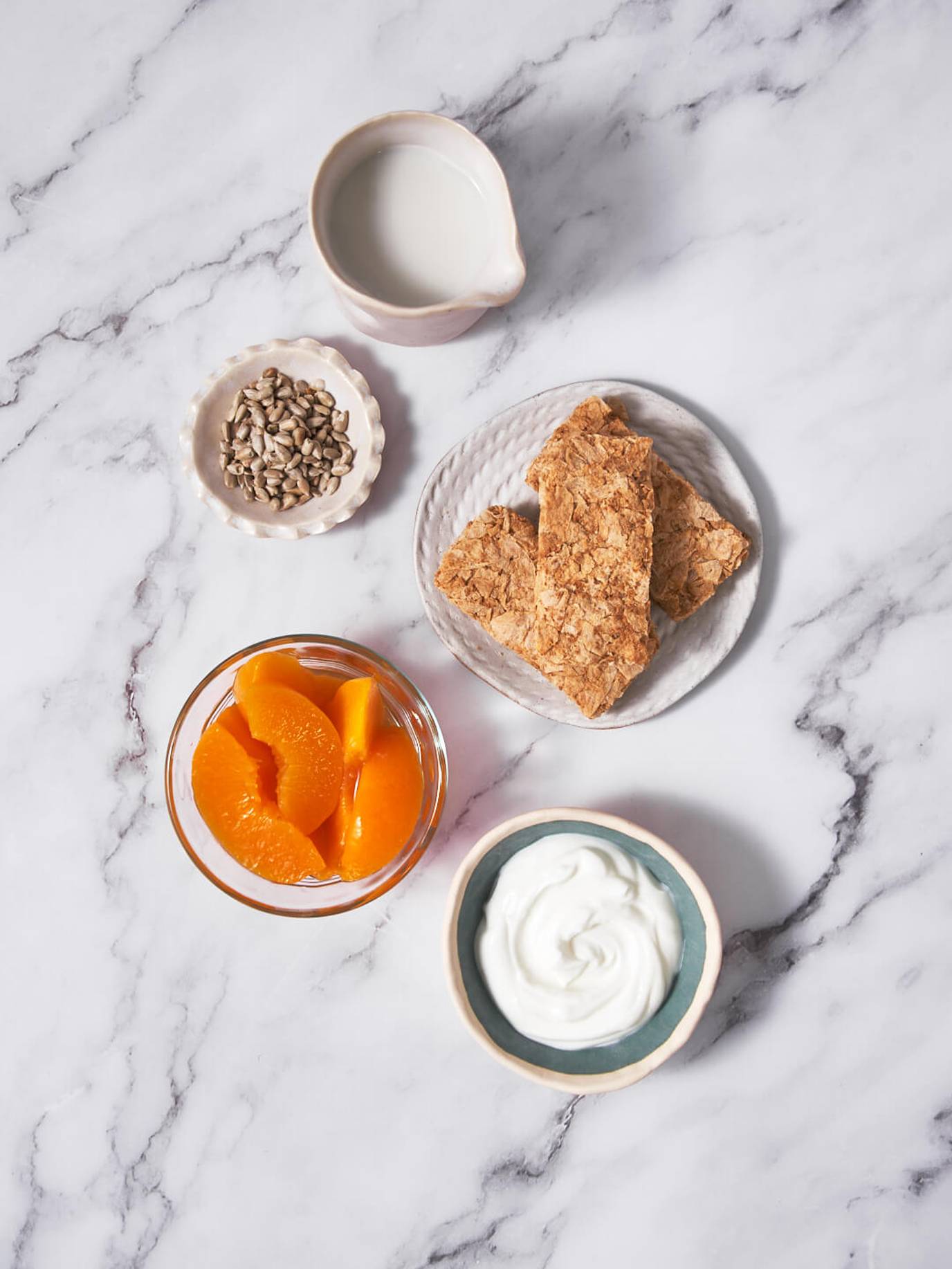 Weet-Bix™ with peaches, sunflower seeds and yoghurt