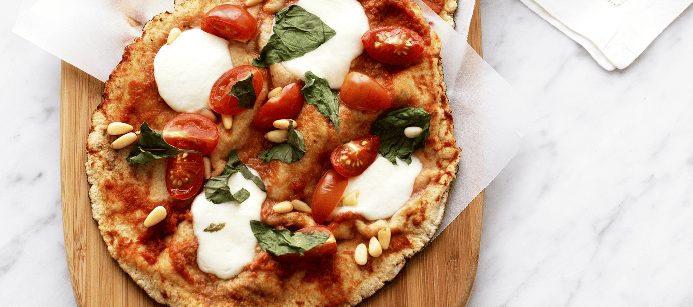 Tomato, bocconcini and basil pizza with cucumber salad